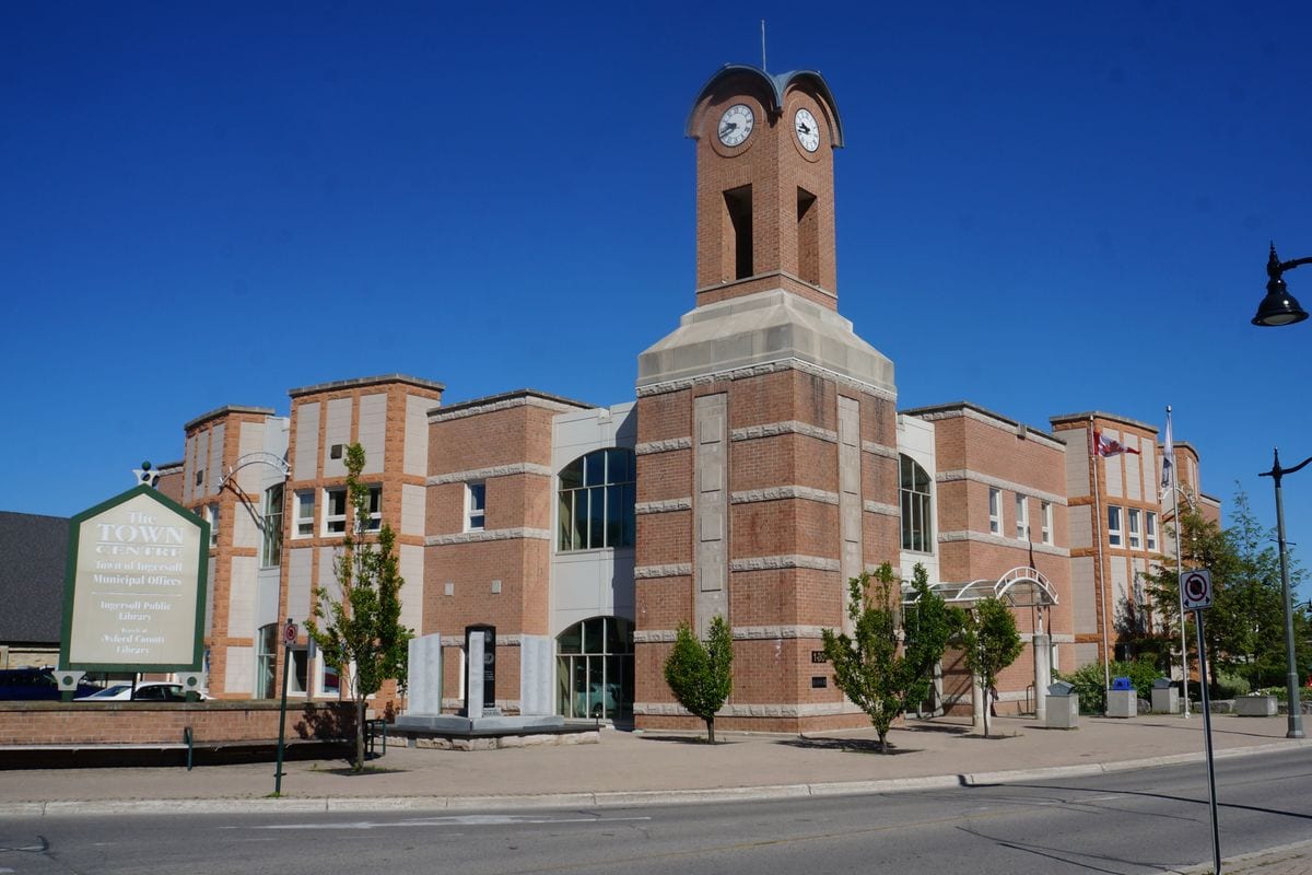 Ingersoll Town Hall clock tower and Town Centre sign on a clear day, Ingersoll, Ontario