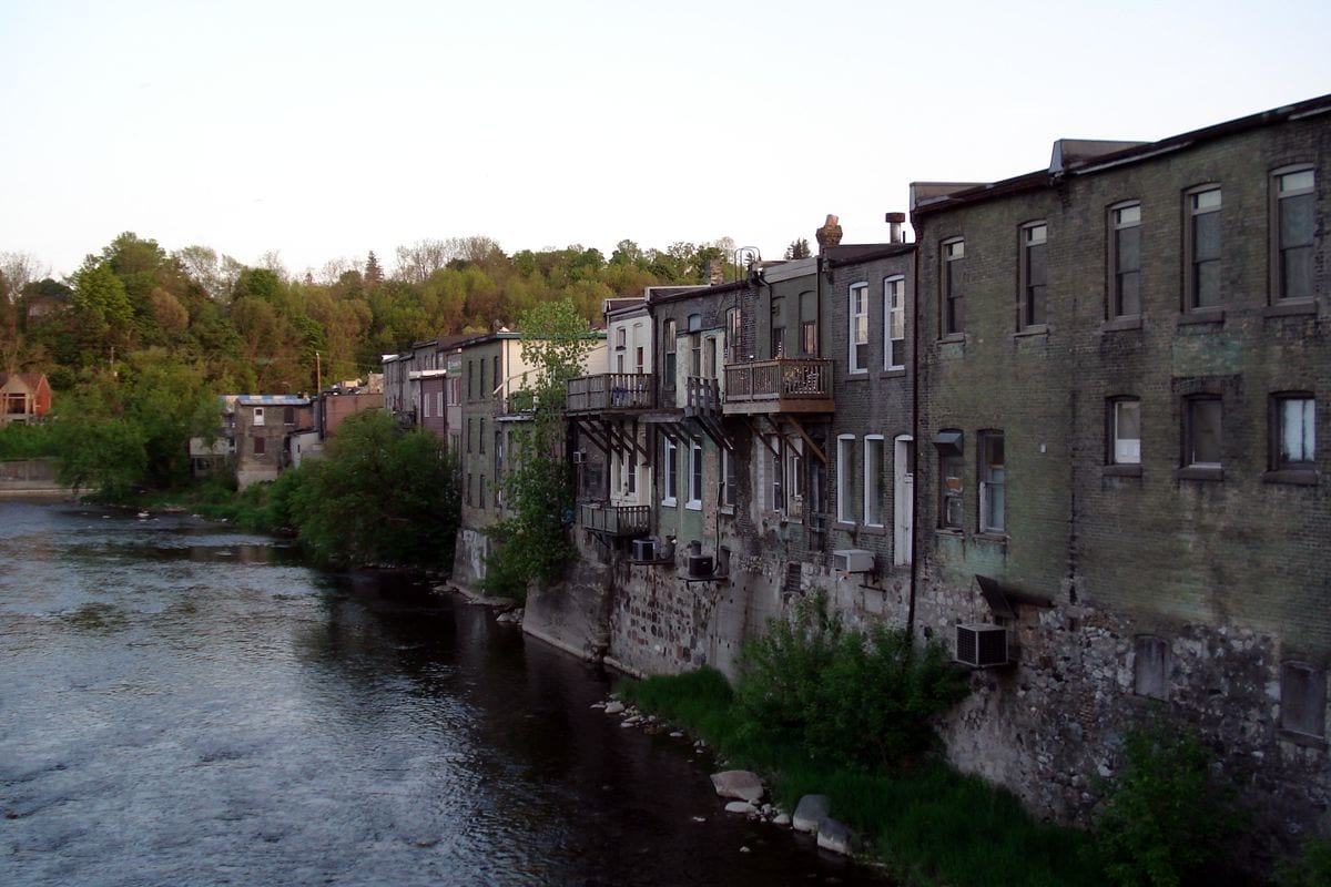 Historic riverside buildings along the Grand River in Paris, Ontario